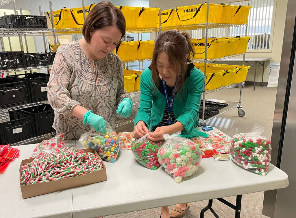 Sara Menard and Kanako Crawley prepared some festive treats for the Holiday Community Food Boxes that will be going out December 15 and 16.
