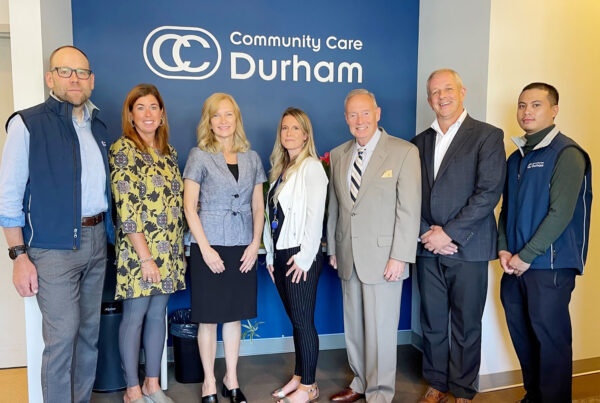 Members of Community Care Durham's Senior Management Team pose for a photo with Whitby MPP Lorne Coe and Ontario Trillium Foundation volunteer Terry Johnston.